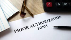 Paper on a desk with the wording, Prior Authorization Form